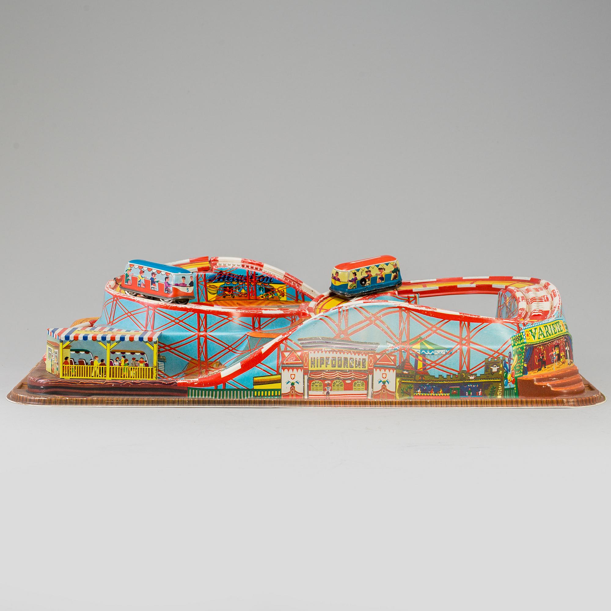 A 1960's  German toy car track with two mechanic buses.