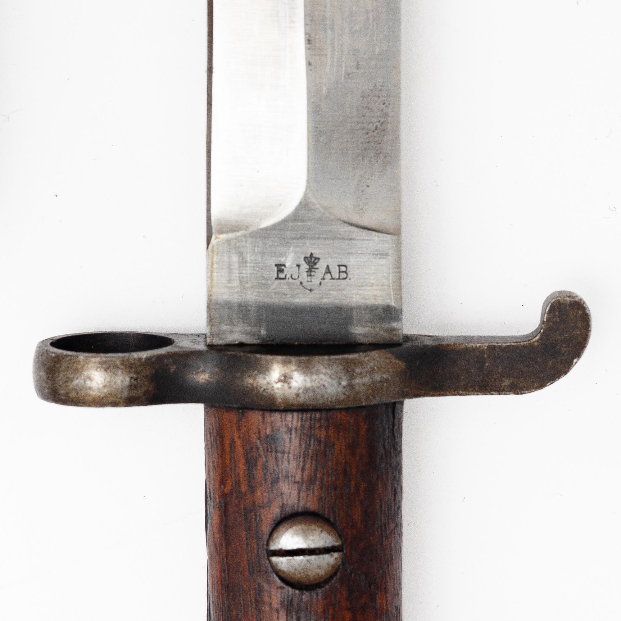 Three Swedish bayonets with scabbards.