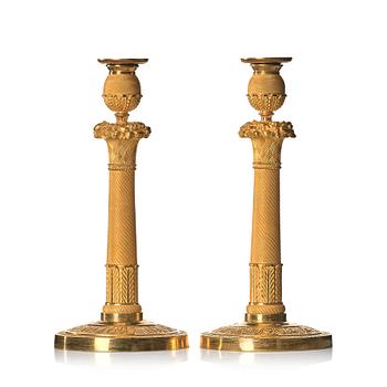 A pair of Empire early 19th century candlesticks.