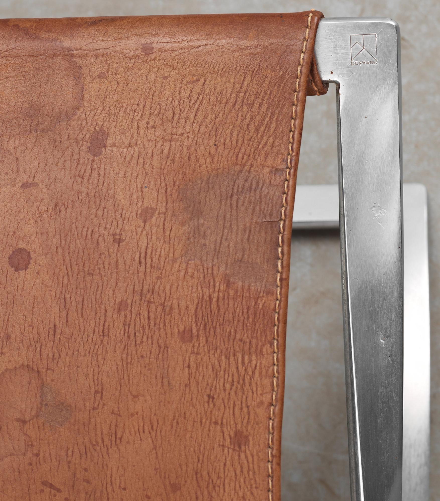 A Poul Kjaerholm 'PK-41' steel and brown leather stool, E Kold Christensen, Denmark,