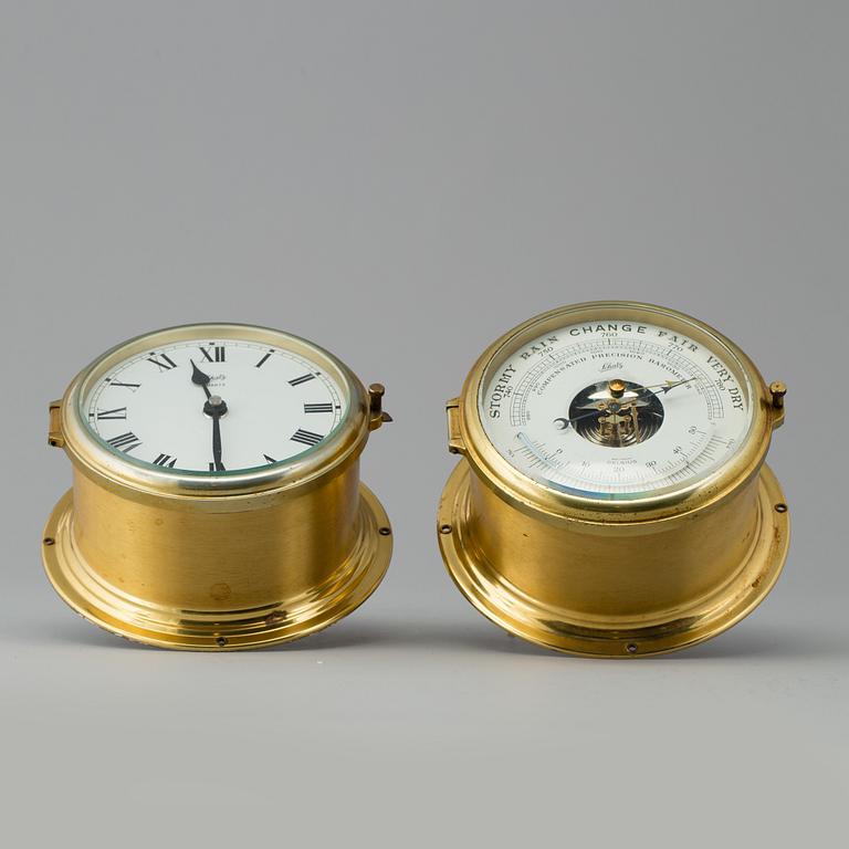 A brass barometer and clock, Schatz, 20th century.