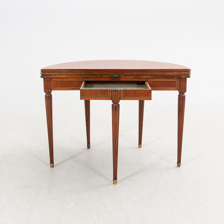 An erarly 1800s mahogany game table.