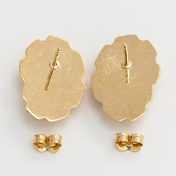 A pair of 14K gold earrings.