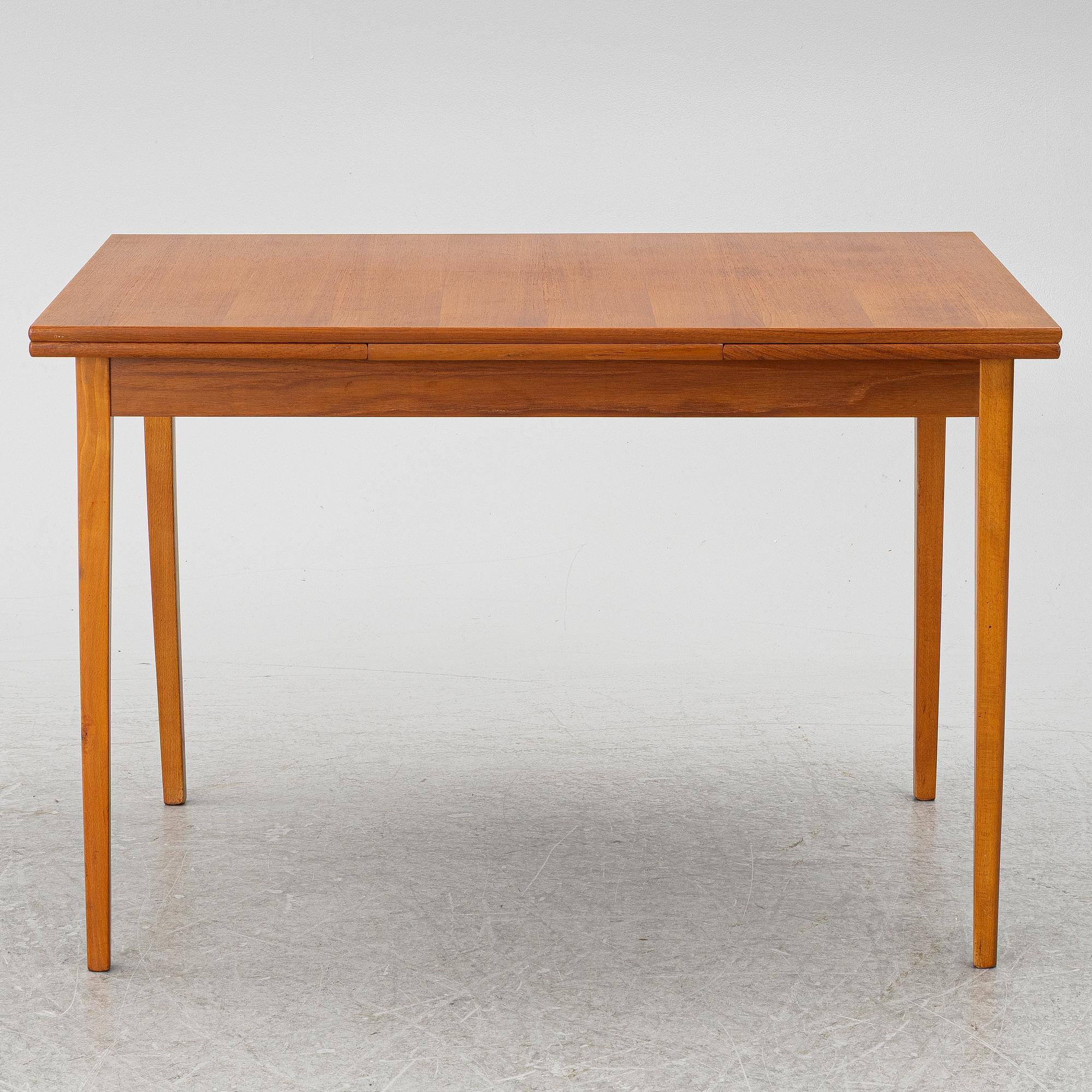 A mid20th century dining table.