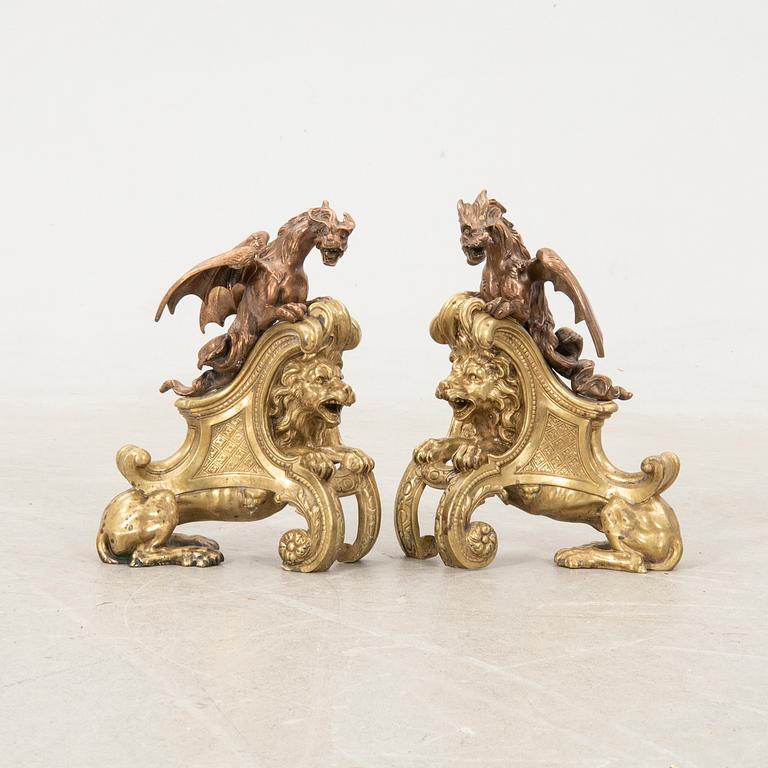 Fire dogs a pair of Baroque style 20th century in the manner of Charles Cressent.