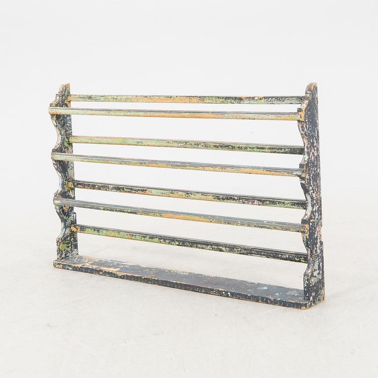 A painted early 1900s shelf.