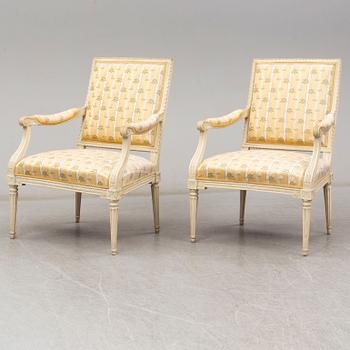 A pair of late 18th century Louis XVI armchairs.