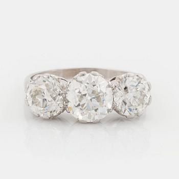 481. A platinum ring set with three old-cut diamonds.