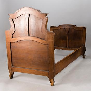 A pair of early 20th Century art nouveau style beds.