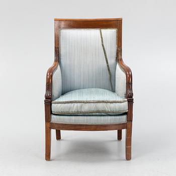 An Empire style mahogany easy chair, early 19th Century.