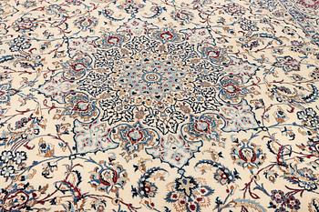 A Nain, part silk carpet, c. 474 x 322 cm.