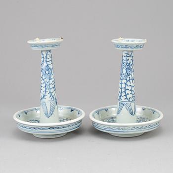 A pair of blue and white candle holders, Qing dynasty, late 19th century.