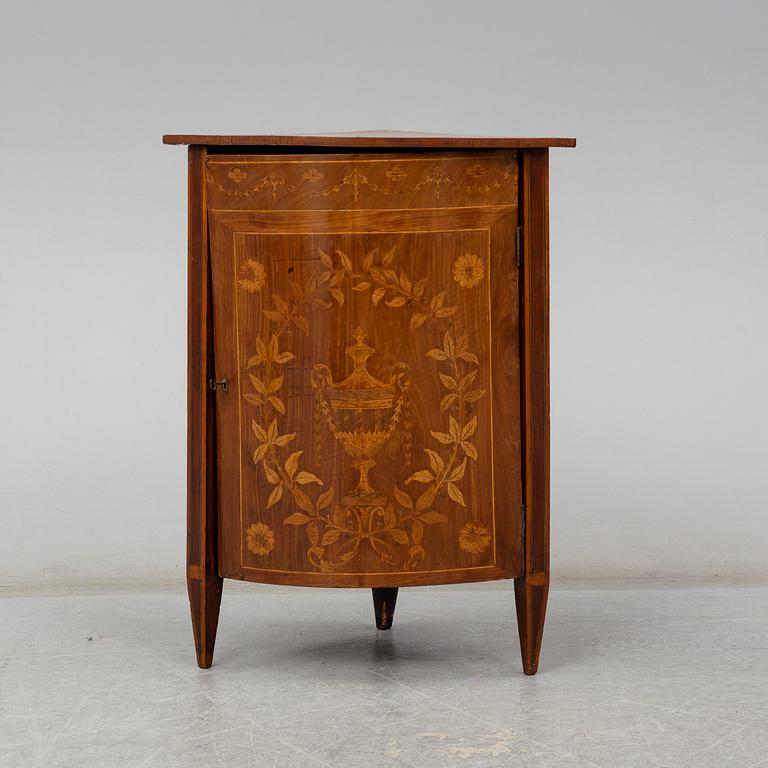 A 19th century corner cabinet.