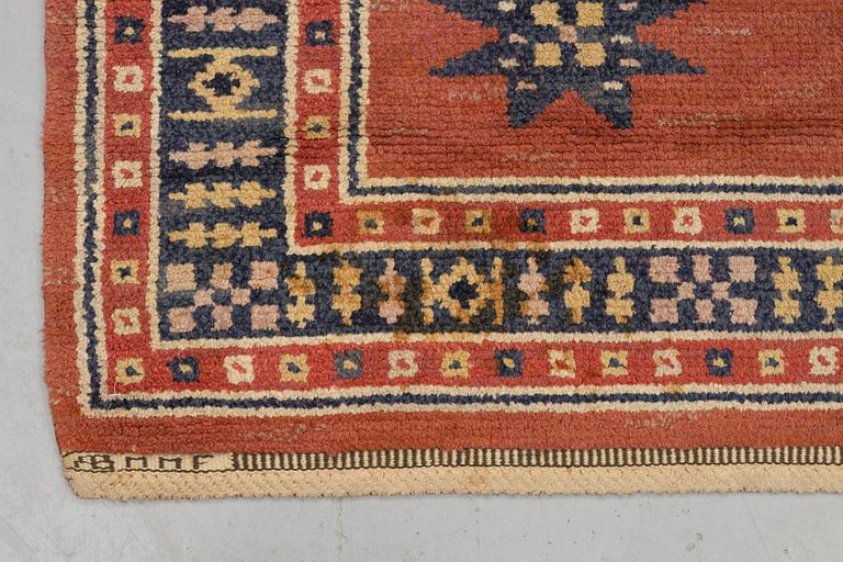 Märta Måås-Fjetterström, a carpet, "Röd Flossa", knotted pile, ca 300 x 272 cm, signed AB MMF.