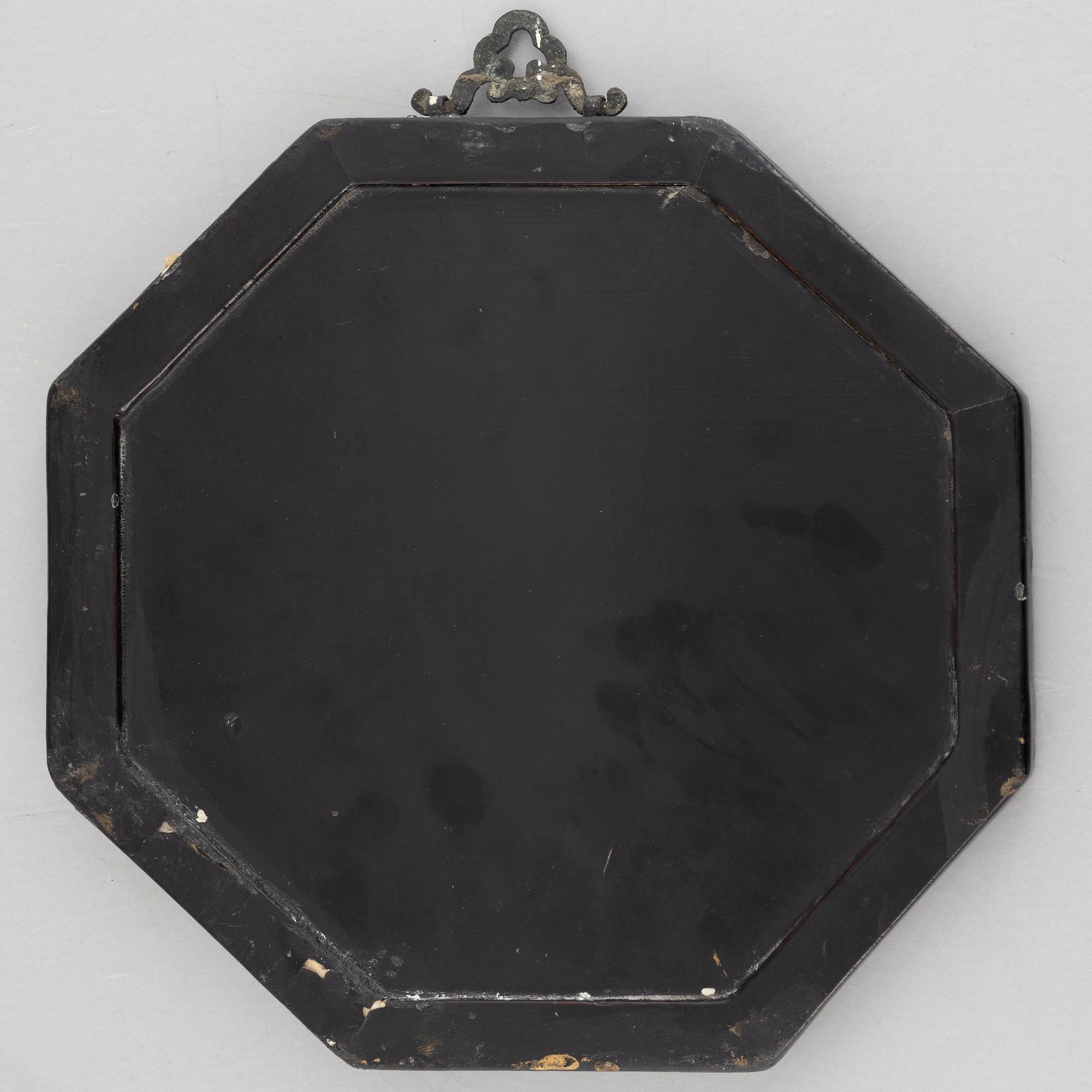 Four black-lacquered wall decorations, China, around 1900.