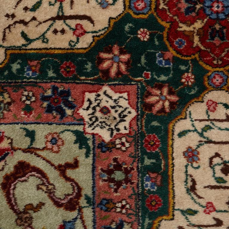 A carpet, semi-antique Tabriz, signed ca 335,5 x 256,5 - 261,5 cm.