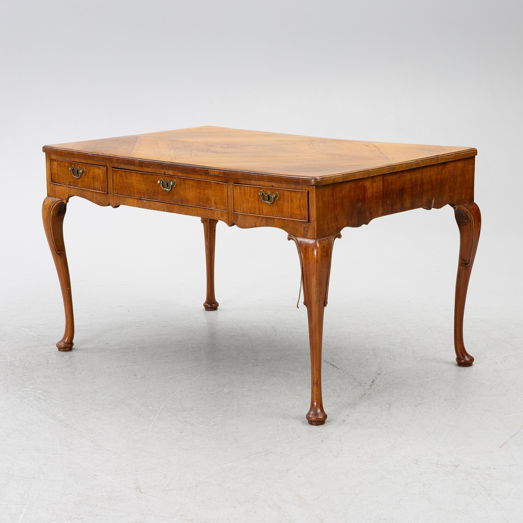 A George II walnut partner's desk, mid 18th century.