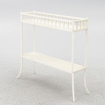 A plant stand, circa 1900.