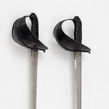 A Swedish pair of military practice swords 1886 pattern.