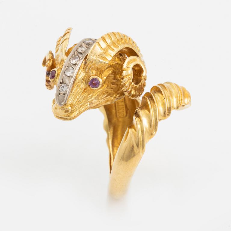 An 18K gold ram´s head ring set with round brilliant-cut diamonds and rubies.