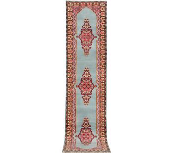 An oriental runner, c. 550 x 74 cm.