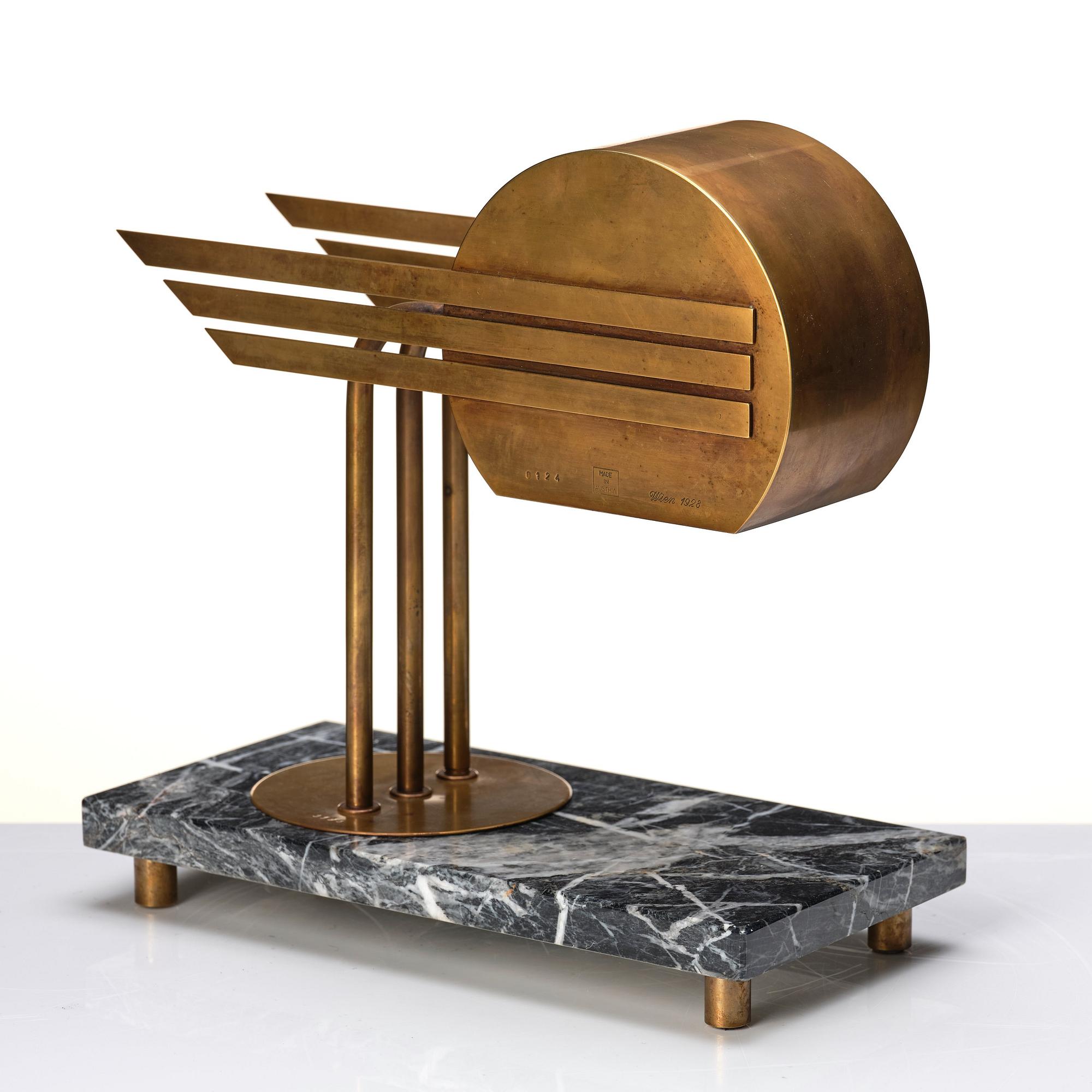 An Austrian brass and black marble table lamp, marked Vienna 1928.