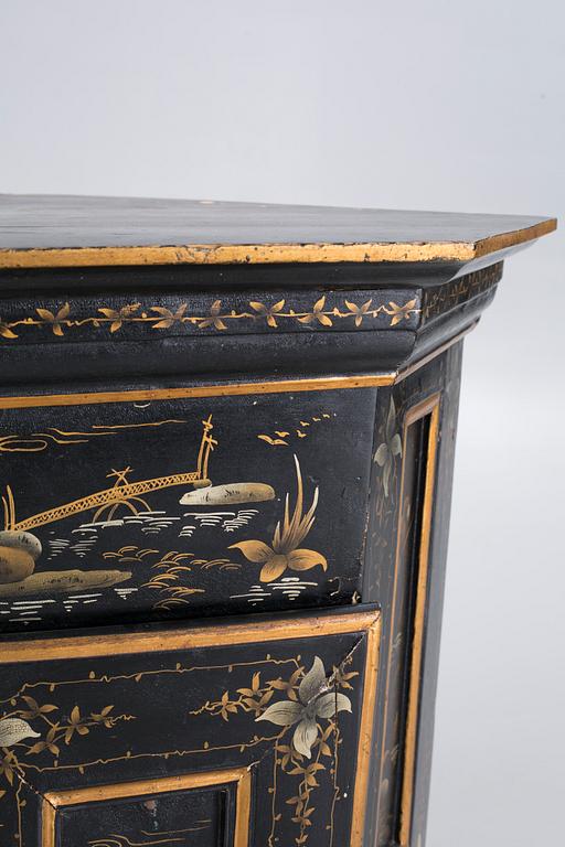 An 18th century corner cabinet.