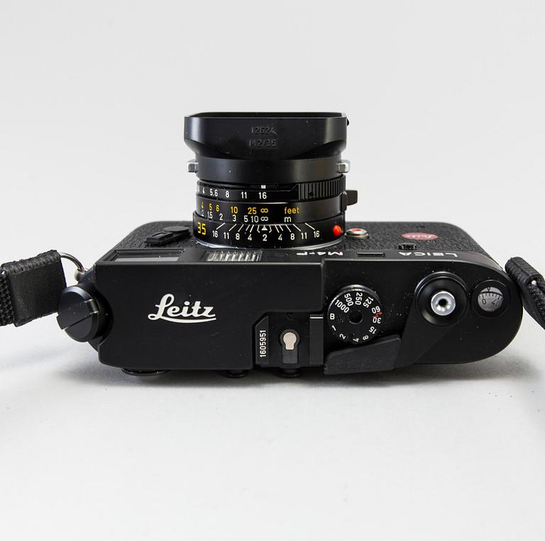 a black body Leica M4-P camera with no 1605951 made by Leitz Canada in 1982. With two lenses and a Leica Meter.