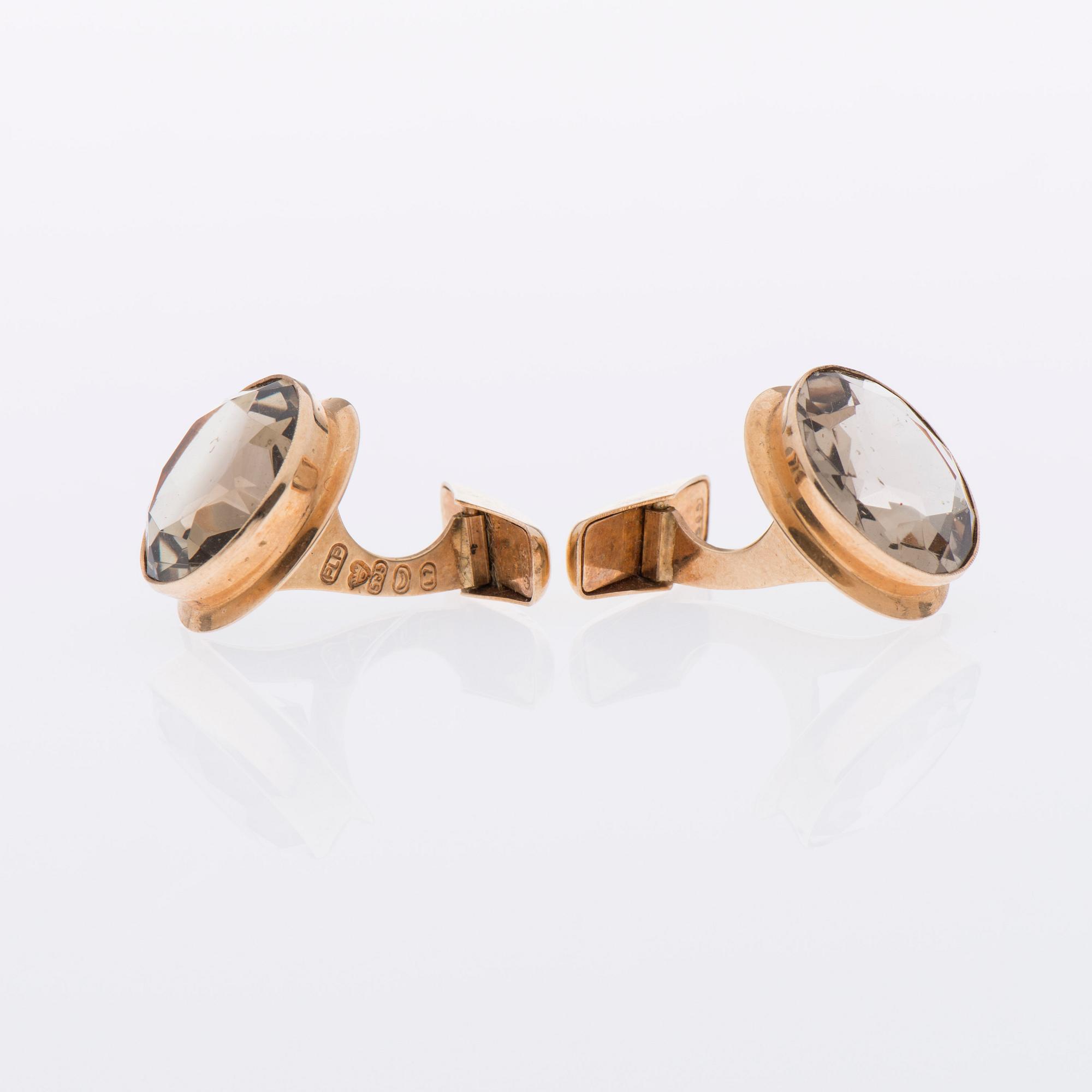 MANSCHETTKNAPPAR, 14K guld, fasettslipade rökkvartser. Peltonen & Kni, Helsingfors 1964.