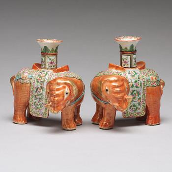 A pair of famille rose Canton elephant candle holders, late Qing dynasty, about 1900.