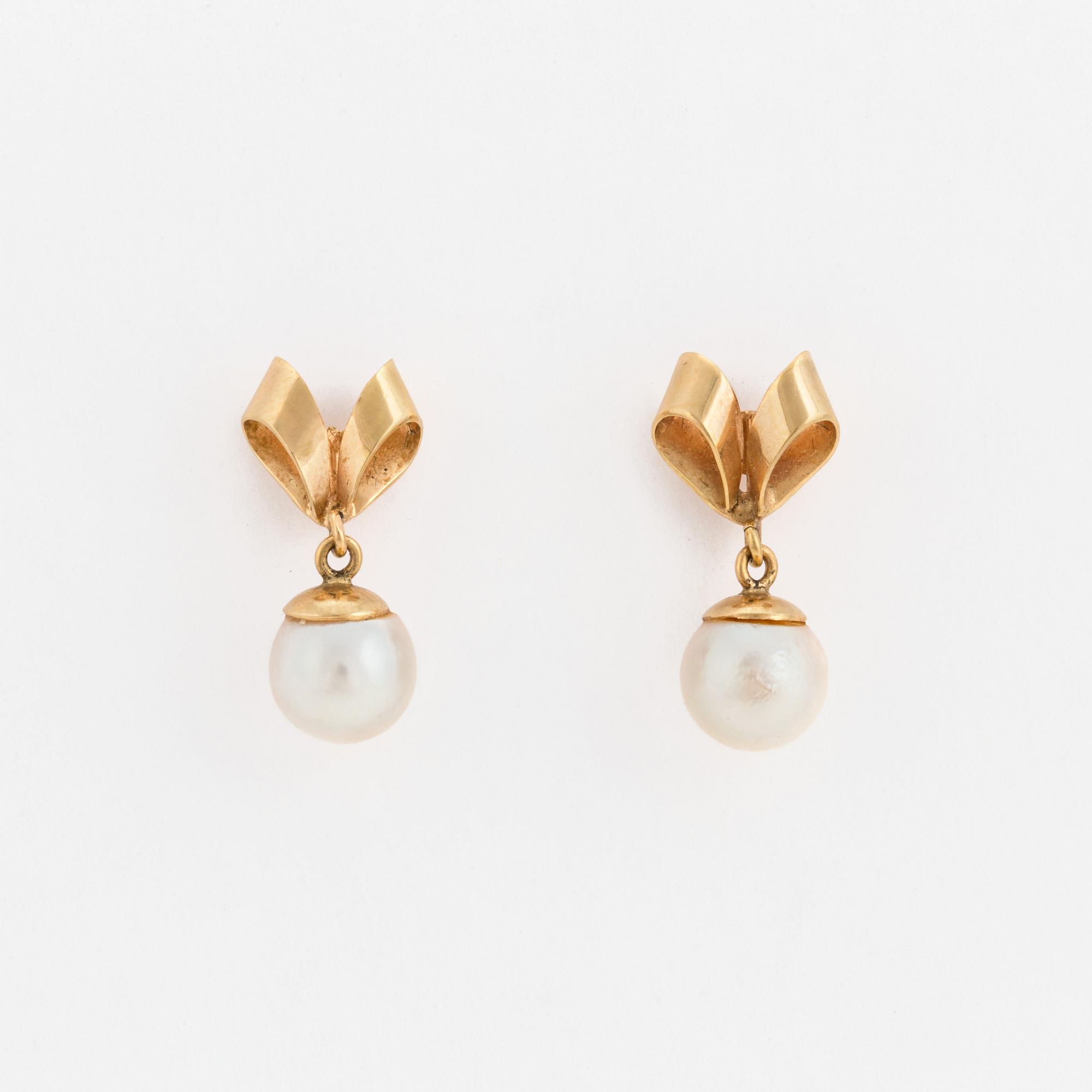 A pair of earrings set with cultured pearls.