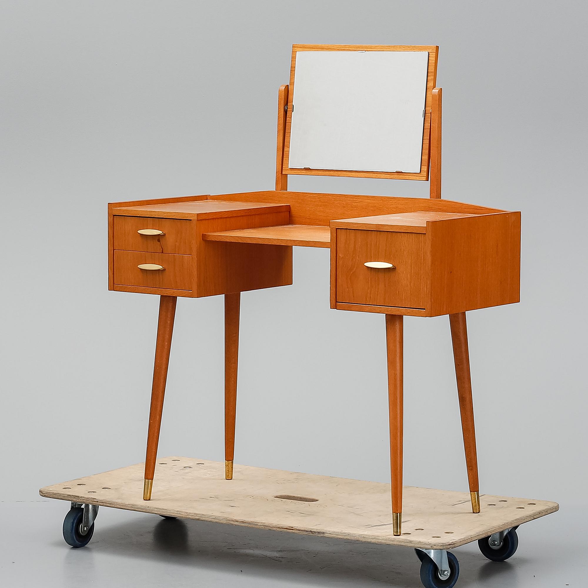 A teak makeup-table from the mid 20th century.
