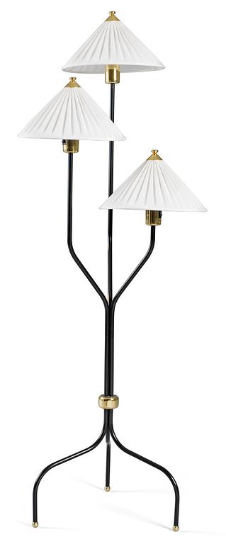 A Josef Frank brass and black laquered floor lamp, Svenskt Tenn, model 2599.