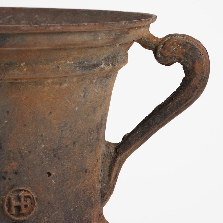 A cast-iron garden urn from Hellefors styckebruk, dated 1791.