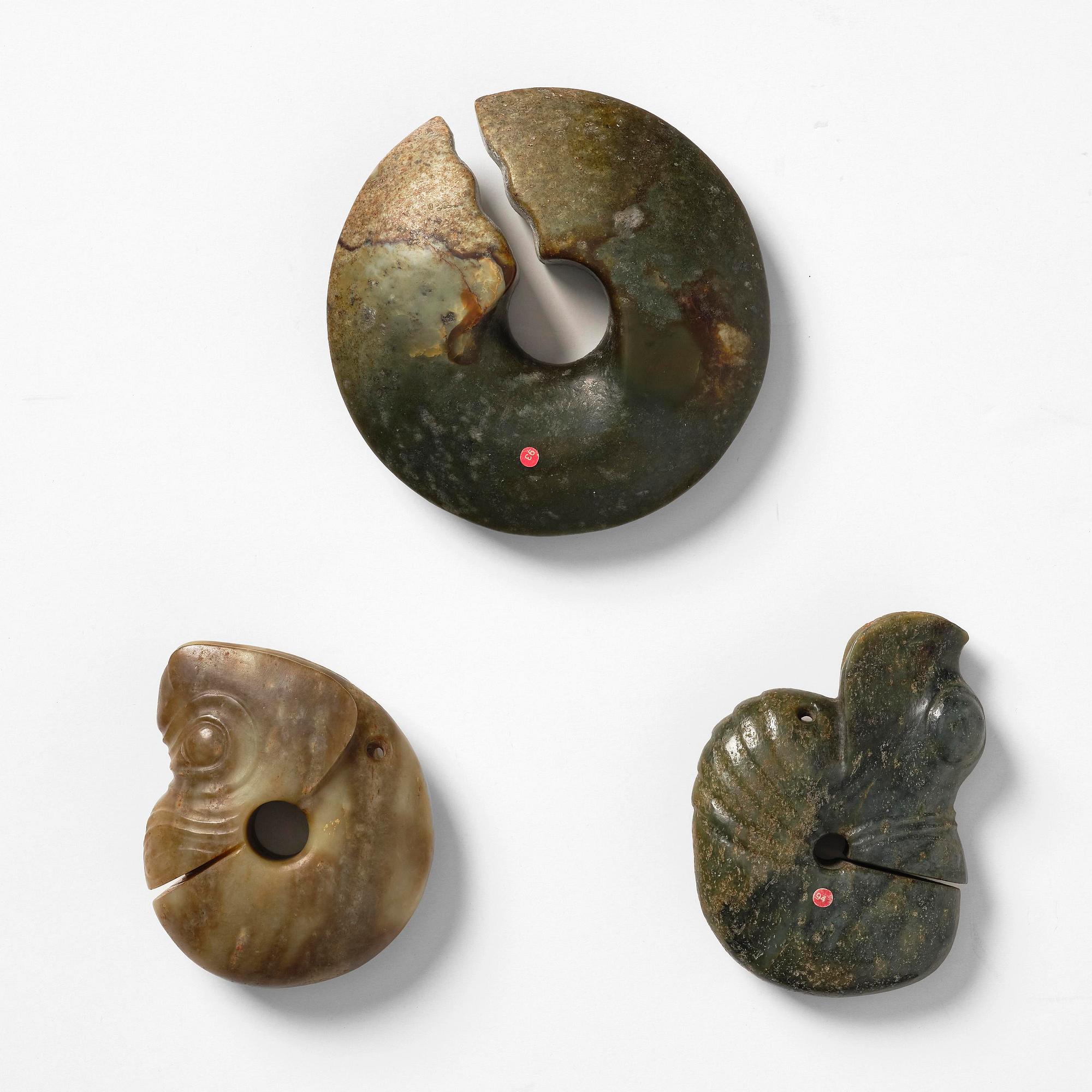A group of three archaistic nephrite 'pig dragon' ornaments.