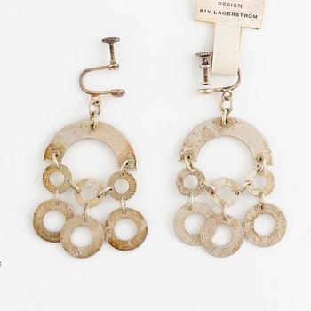 Siv Lagerström, collier och ett par örhängen i vit metall.