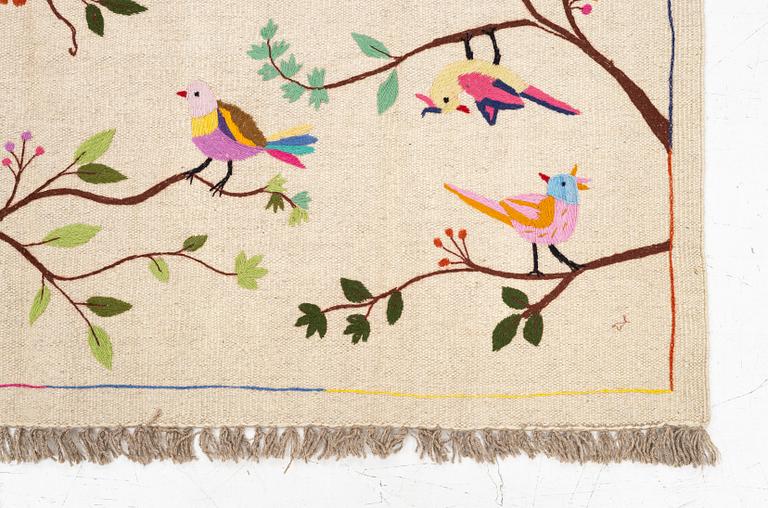 A hand-embroidered kelim rug, c. 183 x 125 cm.