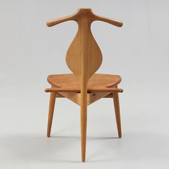 A Hans J Wegner 'Jakkens Hvile' teak chair, Johannes Hansen, Denmark.
