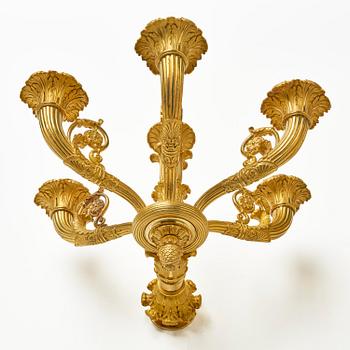 A pair of French Empire six-branch ormolu appliques, ca 1820's.