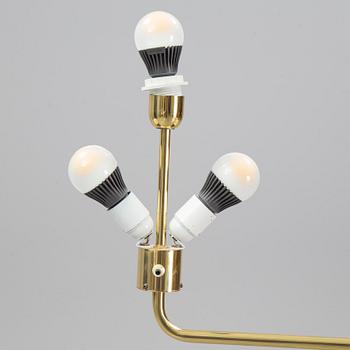 A pair of brass and leather floor lights, Örsjö Industri, 21st century.