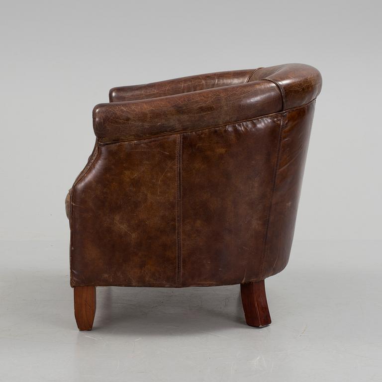 A leather club lounge chair by Newport, ca 2000.