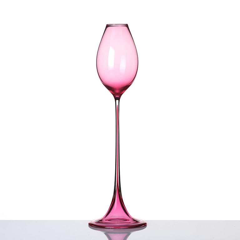 Nils Landberg, a cerise tinted glass goblet, Orrefors Sweden 1957.