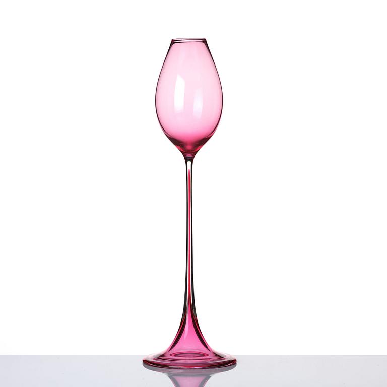 Nils Landberg, a cerise tinted glass goblet, Orrefors Sweden 1957.