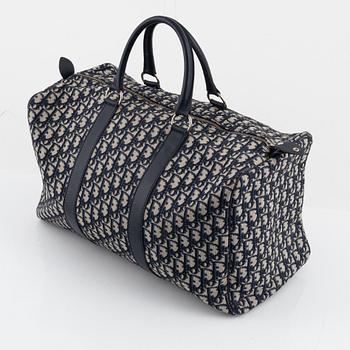 Christian Dior, a canvas weekend bag.