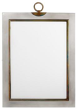 408. A Svenskt Tenn pewter and brass mirror, Stockholm 1950.