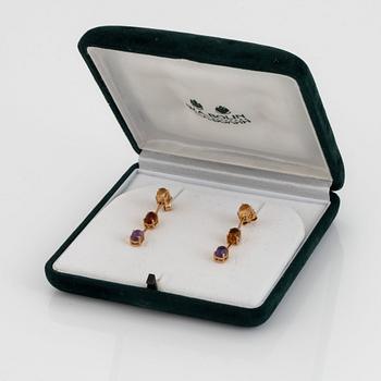 A pair of 18K gold earrings set with cabochon-cut citrines and amethysts.