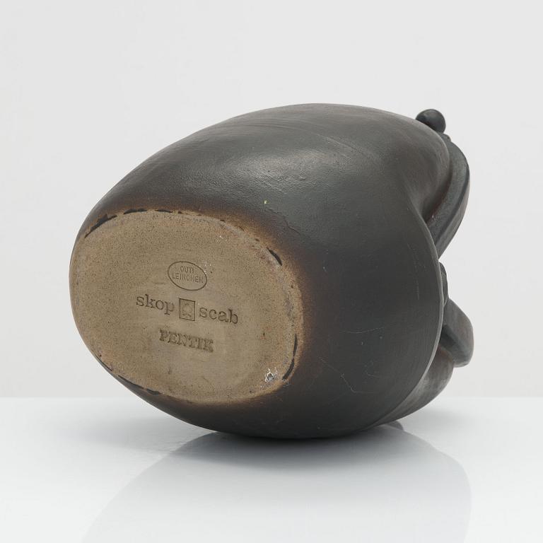 Outi Leinonen, a ceramic vase formed as a purse for Pentik, Finland.