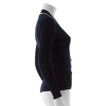 CÉLINE, a navy blue cardigan.
