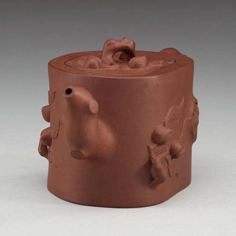 A Chinese Yixing tea pot with cover, 20th Century.