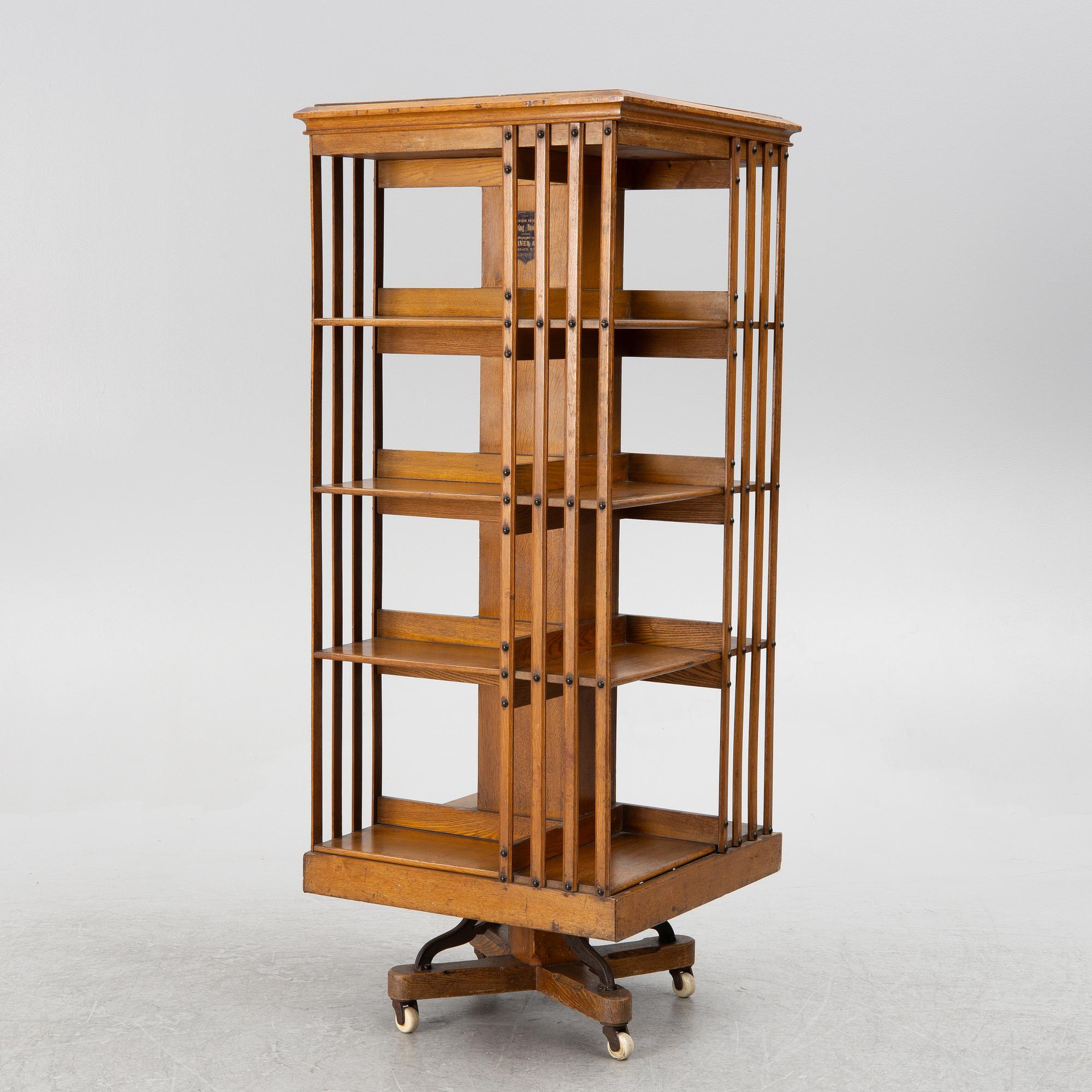 An oak Revolving bookcase by Trübner & Co, England, early 20th century.